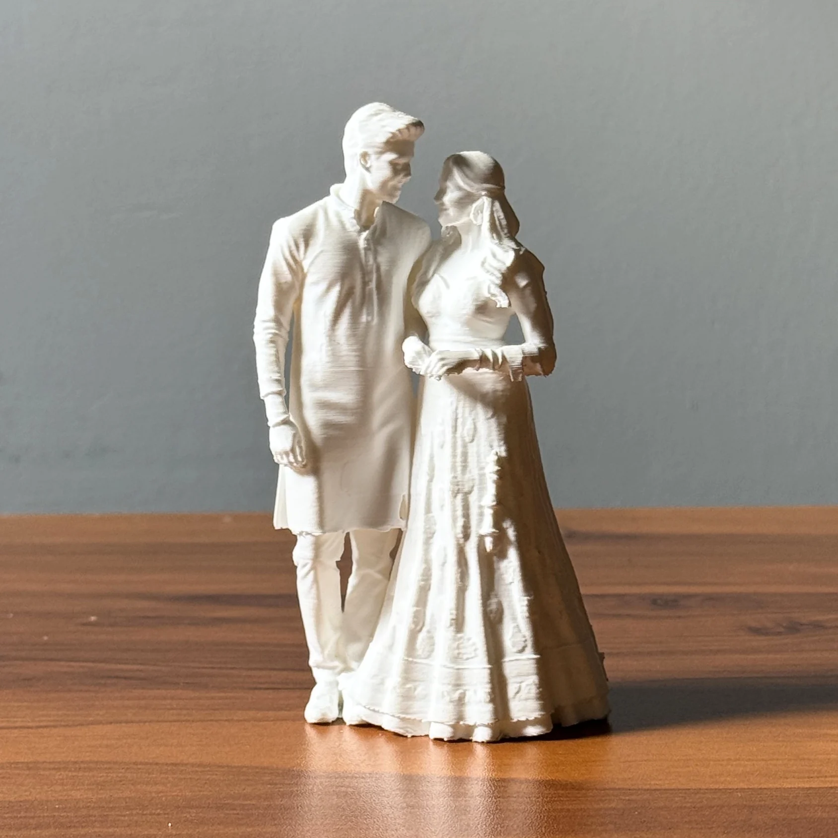 The same couple as a white 3D-printed miniature by Myprus